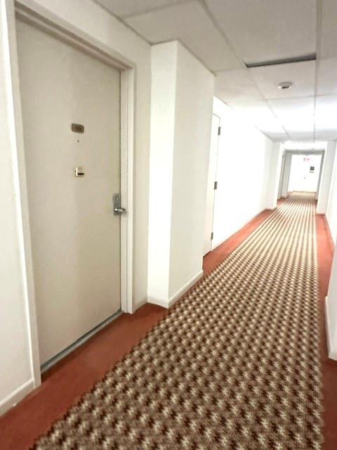 10777 West Sample Road, Unit 418 Coral Springs, FL 33065 - Photo 21 of 21 a bedroom with a bed and a window