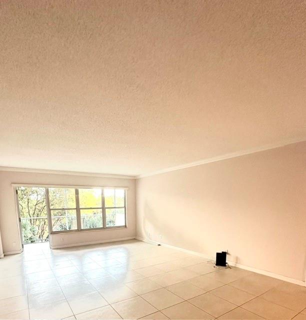 10777 West Sample Road, Unit 418 Coral Springs, FL 33065 - Photo 6 of 21 a view of an empty room with a window