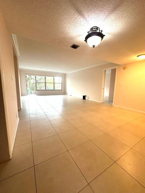 10777 West Sample Road, Unit 418 Coral Springs, FL 33065 - Photo 7 of 21 a view of an empty room with a window
