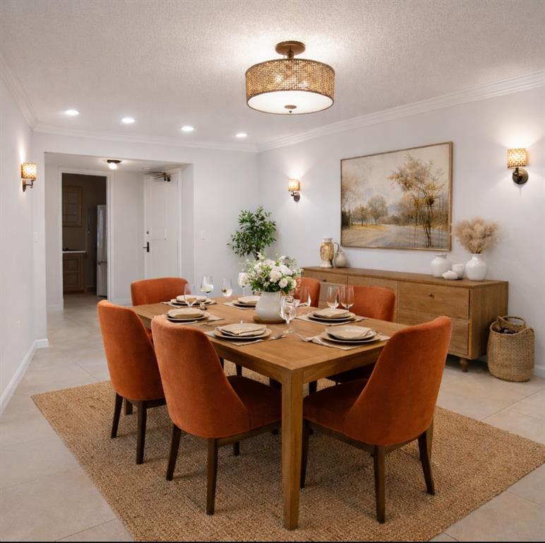10777 West Sample Road, Unit 418 Coral Springs, FL 33065 - Photo 8 of 21 a view of a dining room with furniture