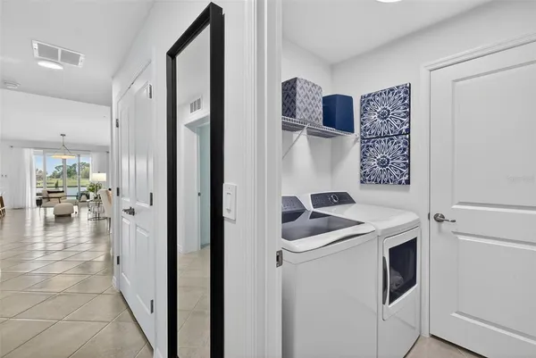a kitchen with stainless steel appliances granite countertop a refrigerator and a stove
