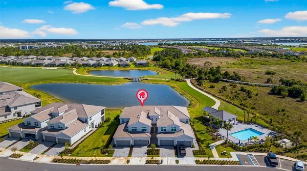 an aerial view of a house with a swimming pool