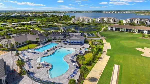 a view of a swimming pool with an outdoor seating