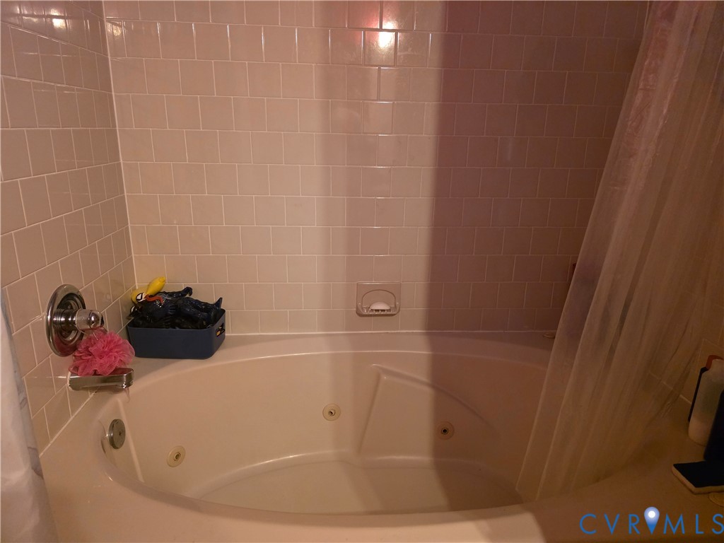 3161 Dorrell Road Aylett, VA 23009 - Photo 11 of 41 a bathroom with a white tub