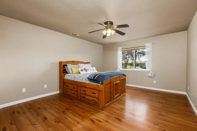 a bed room with a bed and a window