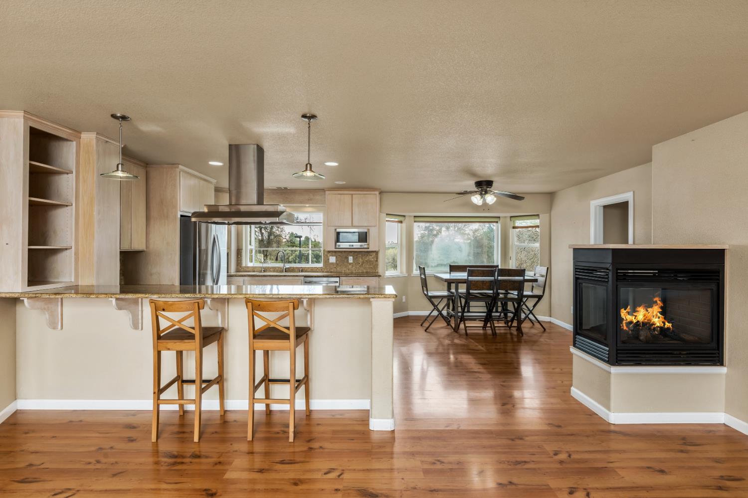 20839 Bear Hollow Road Grass Valley, CA 95949 - Photo 8 of 44 4 person dine up granite slab bar with pendent lighting