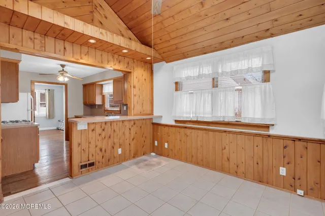 a view of a hallway with chandelier
