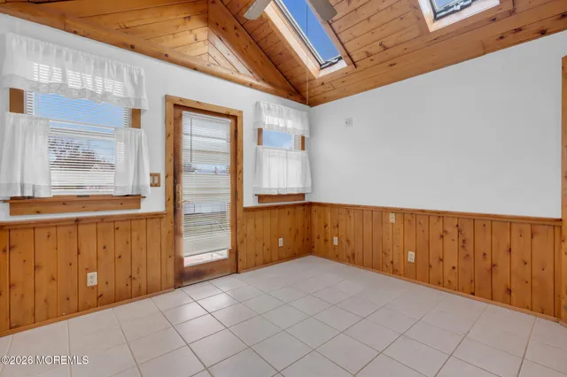 a view of a room with wooden walls