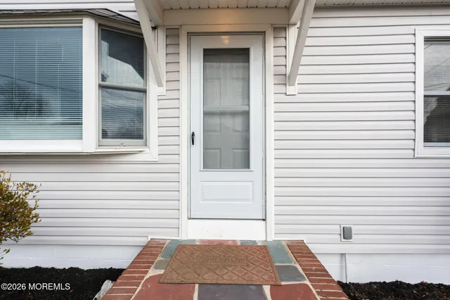 a view of a door and a window