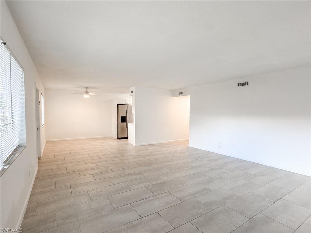 4631 Bayshore Drive, Unit L2 Naples, FL 34112 - Photo 15 of 41 a view of an empty room with a window