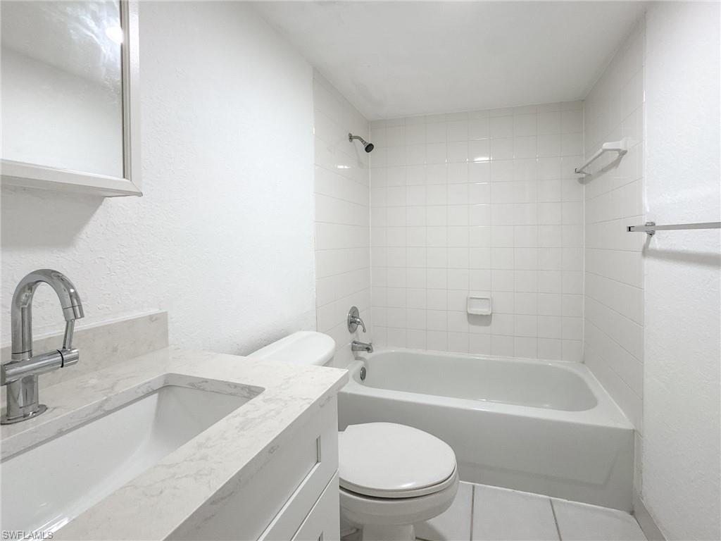 4631 Bayshore Drive, Unit L2 Naples, FL 34112 - Photo 18 of 41 a bathroom with a sink toilet and bathtub