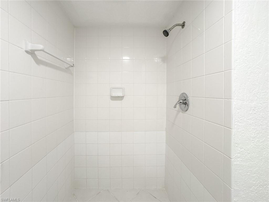 4631 Bayshore Drive, Unit L2 Naples, FL 34112 - Photo 23 of 41 a bathroom with a shower
