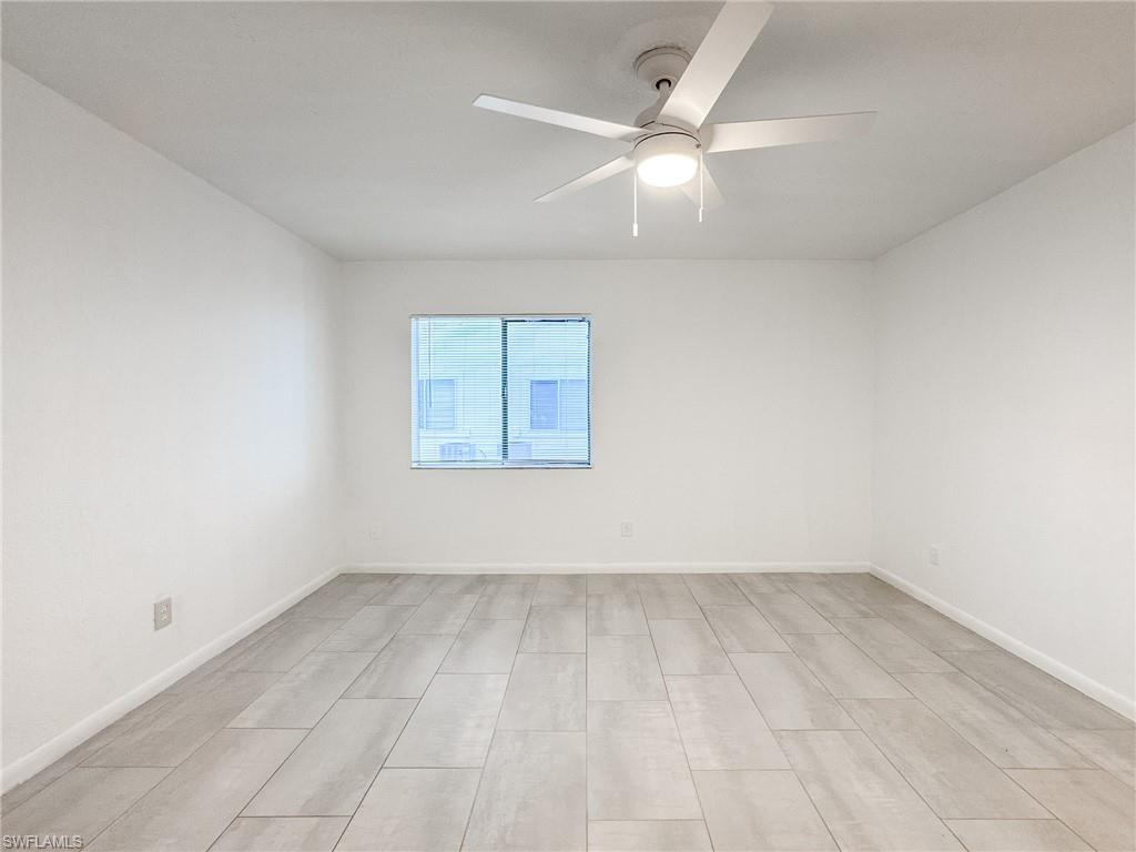 4631 Bayshore Drive, Unit L2 Naples, FL 34112 - Photo 25 of 41 an empty room with a window