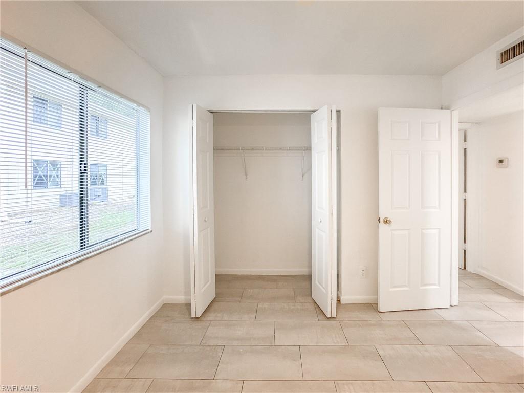 4631 Bayshore Drive, Unit L2 Naples, FL 34112 - Photo 28 of 41 a view of a livingroom with an empty space and a window