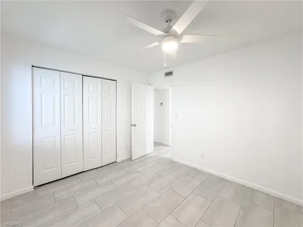 an empty room with fan
