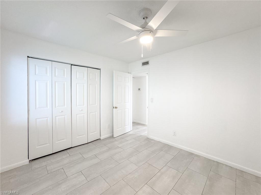 4631 Bayshore Drive, Unit L2 Naples, FL 34112 - Photo 30 of 41 an empty room with fan