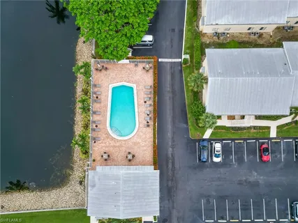 an aerial view of a house with swimming pool