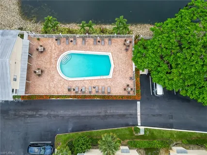 an aerial view of a house with a swimming pool
