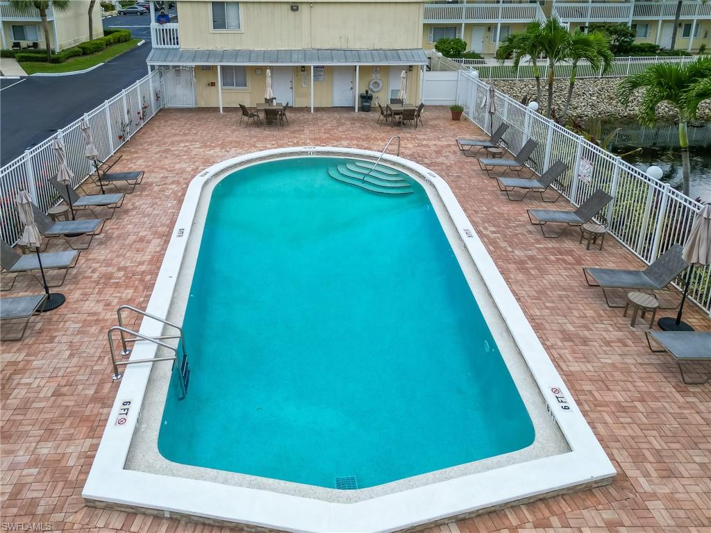 4631 Bayshore Drive, Unit L2 Naples, FL 34112 - Photo 39 of 41 a view of swimming pool from a balcony