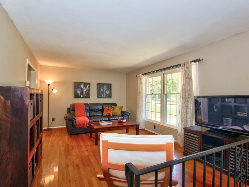 4801 Radcliff Road Raleigh, NC 27609 - Photo 2 of 25 Freshly painted family room with lots of natural light, smooth ceilings and hardwood floors! Family Room