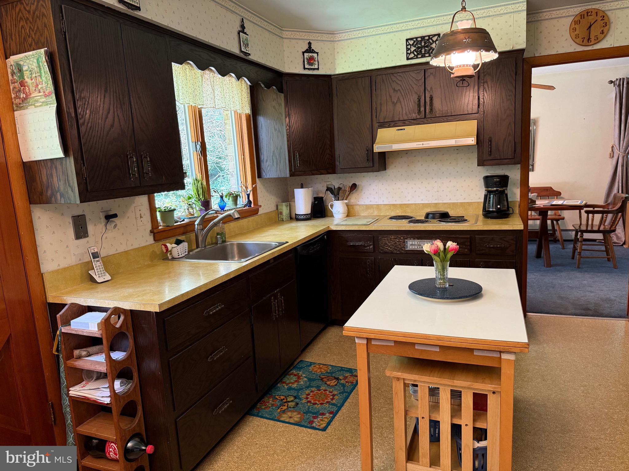 4050 Grande View Drive Pylesville, MD 21132 - Photo 17 of 40 a kitchen with a sink stove and cabinets