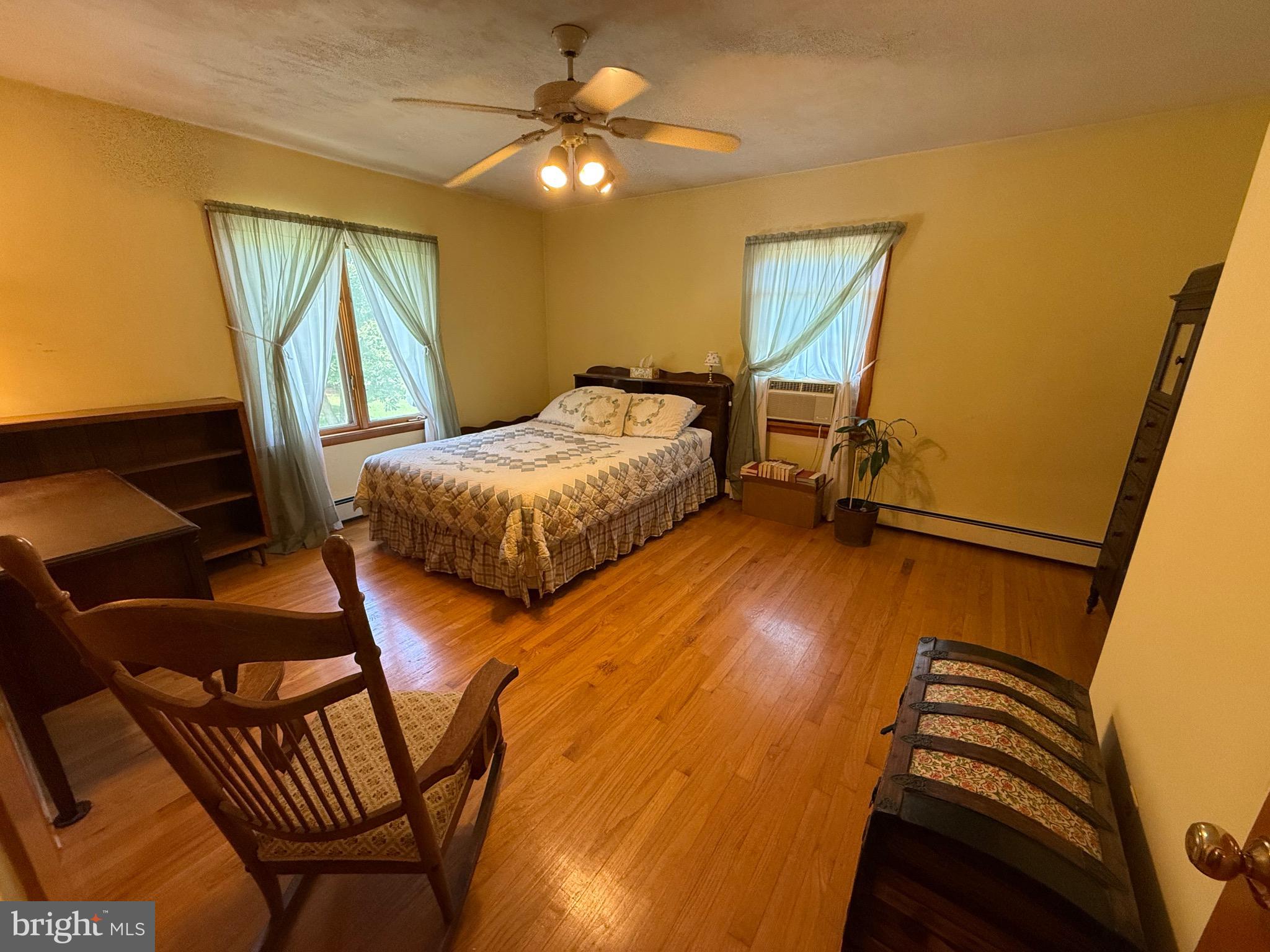 4050 Grande View Drive Pylesville, MD 21132 - Photo 26 of 40 a bedroom with a bed and wooden floor