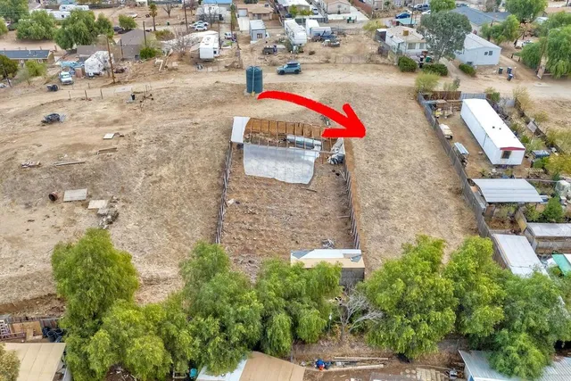 an aerial view of residential house with outdoor space