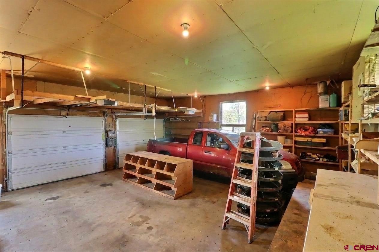 39389 Pitkin Road Paonia, CO 81428 - Photo 27 of 34 650 square foot garage. This picture was decluttered using AI technology.