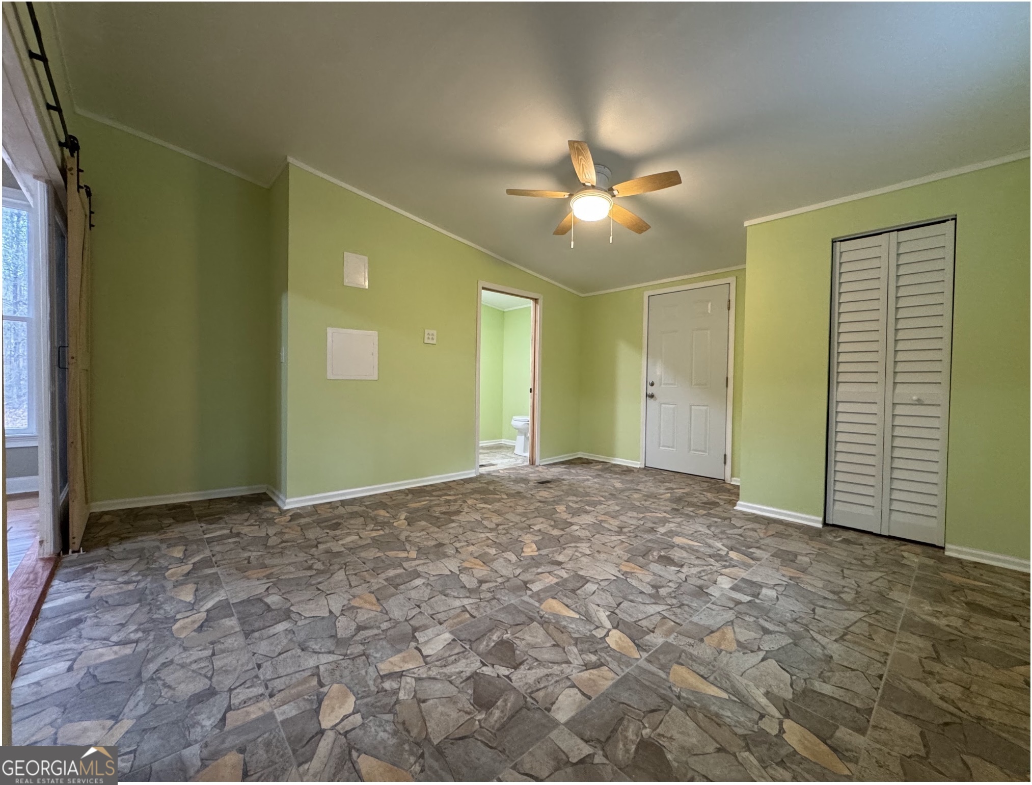 1206 Jasmine Road Dublin, GA 31021 - Photo 17 of 33 an empty room with closet and a ceiling fan