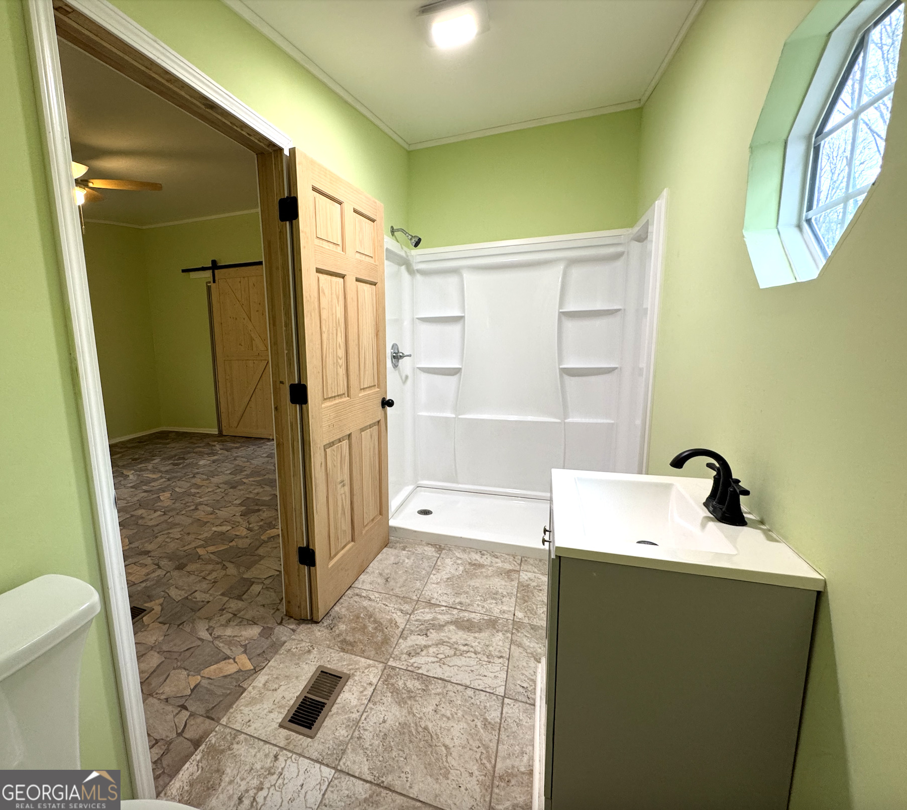 1206 Jasmine Road Dublin, GA 31021 - Photo 19 of 33 a bathroom with a sink and a mirror