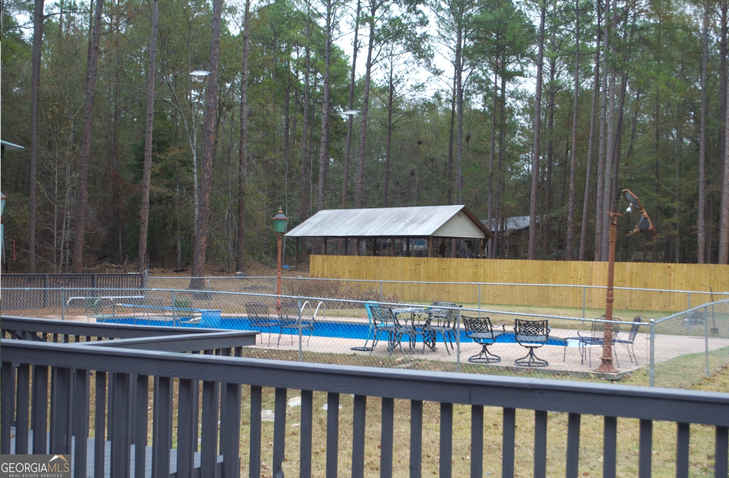 1206 Jasmine Road Dublin, GA 31021 - Photo 30 of 33 a view of a swimming pool with a patio and a yard