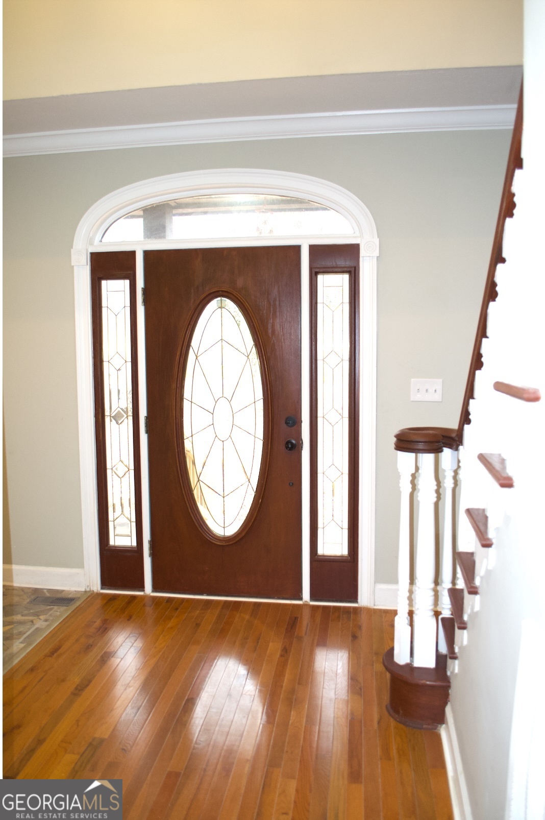 1206 Jasmine Road Dublin, GA 31021 - Photo 9 of 33 a view of a livingroom with wooden floor and a large window