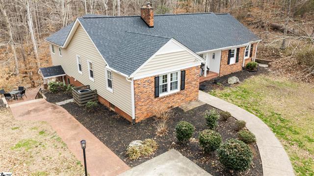 This house features a classic brick and siding exterior, offering a blend of traditional and modern charm.