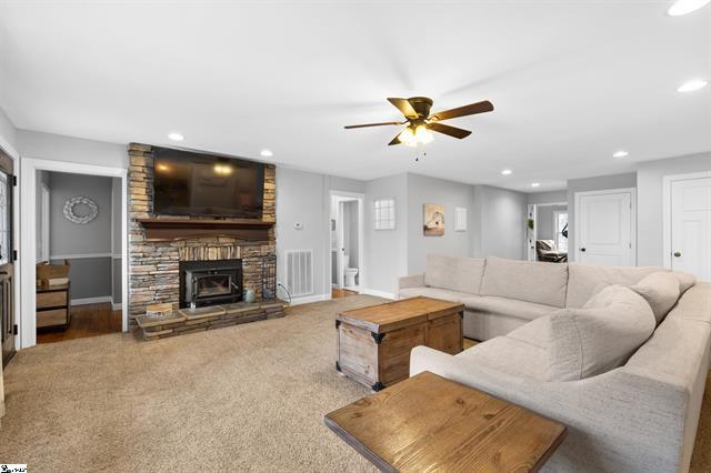 5754 Highway 20 Due West, SC 29639 - Photo 4 of 15 This living room features a cozy fireplace, perfect for relaxing evenings.