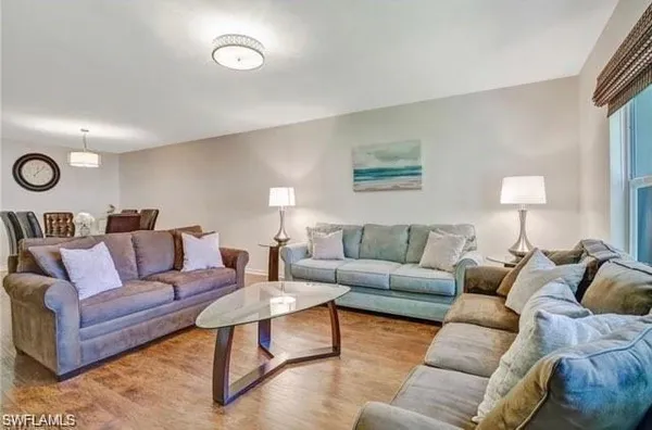 a living room with furniture and a rug