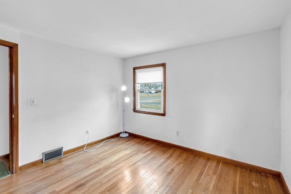 78 Scarsdale Road Springfield, MA 01129 - Photo 8 of 24 an empty room with wooden floor and windows