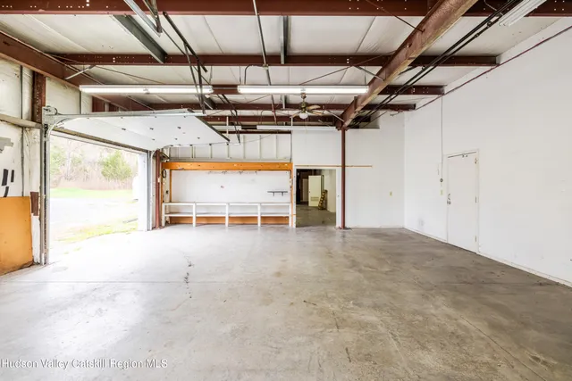 a view of a room with wooden walls