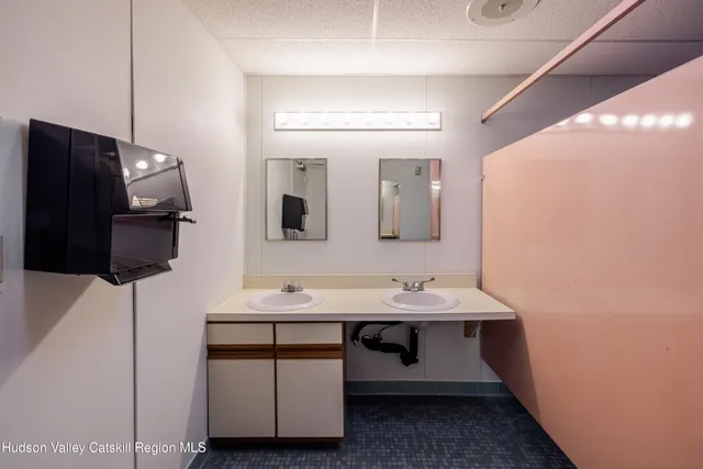 an aerial view of residential building and car parked