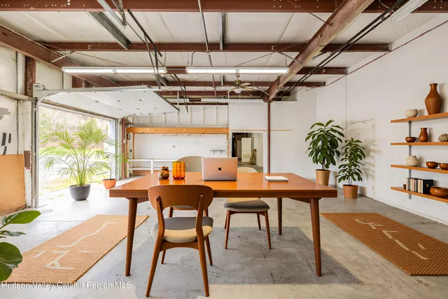 a dinning table and chairs in a room