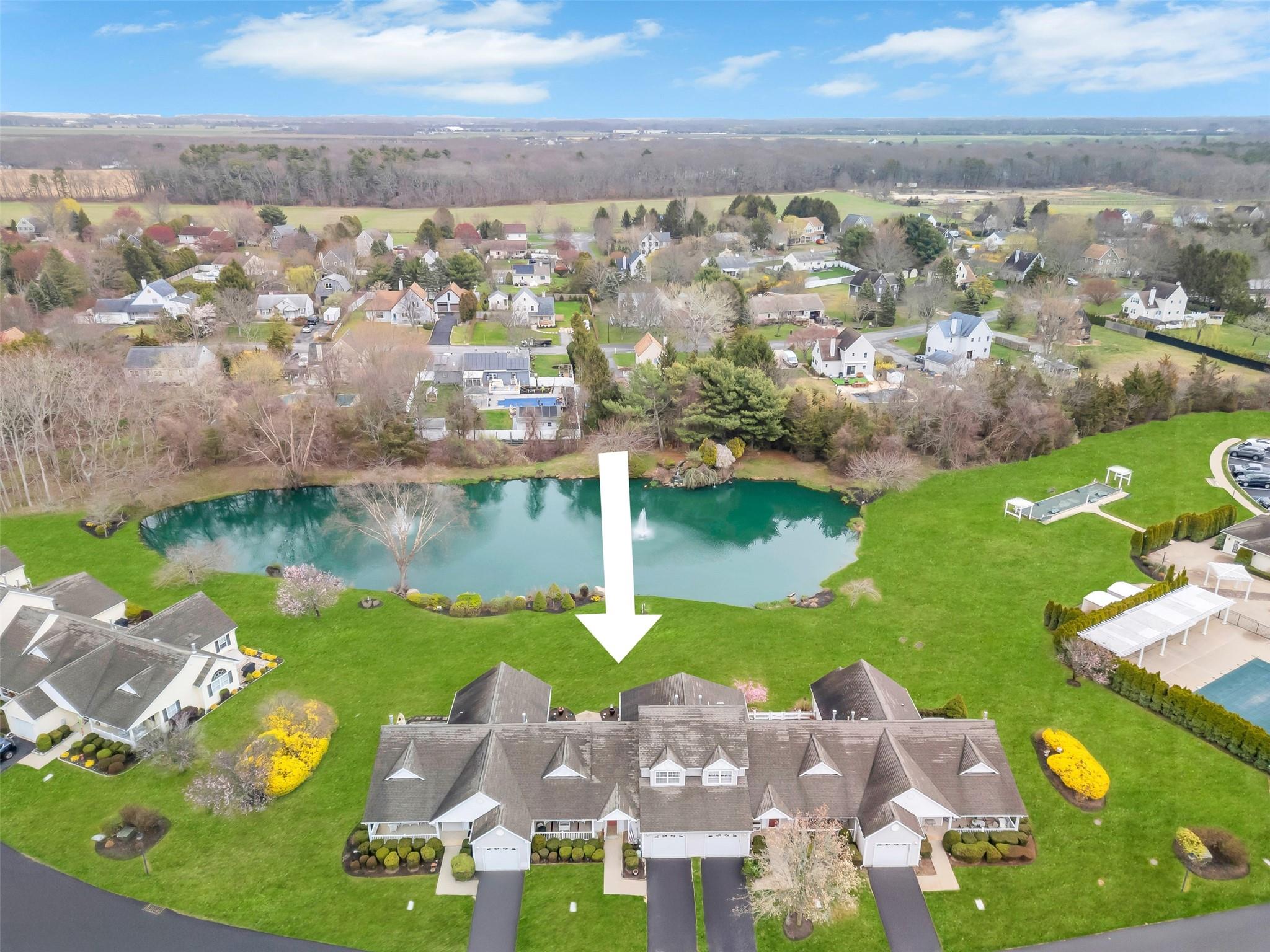 an aerial view of ocean residential houses with outdoor space and seating