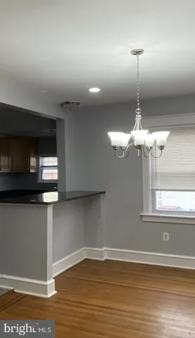 a view of a living room with a wooden floor