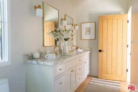 a bath tub sitting in a bathroom next to a window