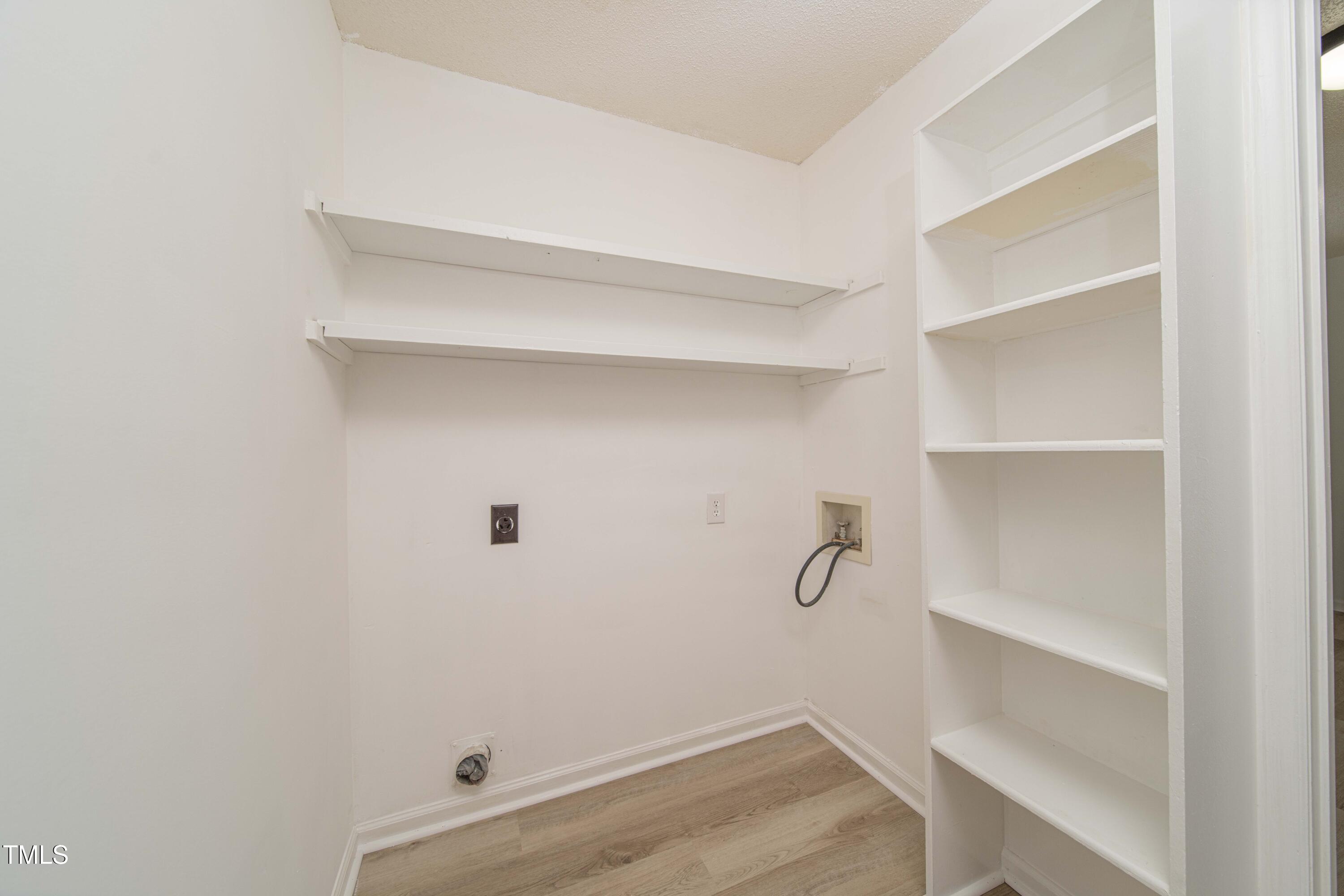 4258 Kaplan Drive Raleigh, NC 27606 - Photo 8 of 20 a view of an empty walk in closet