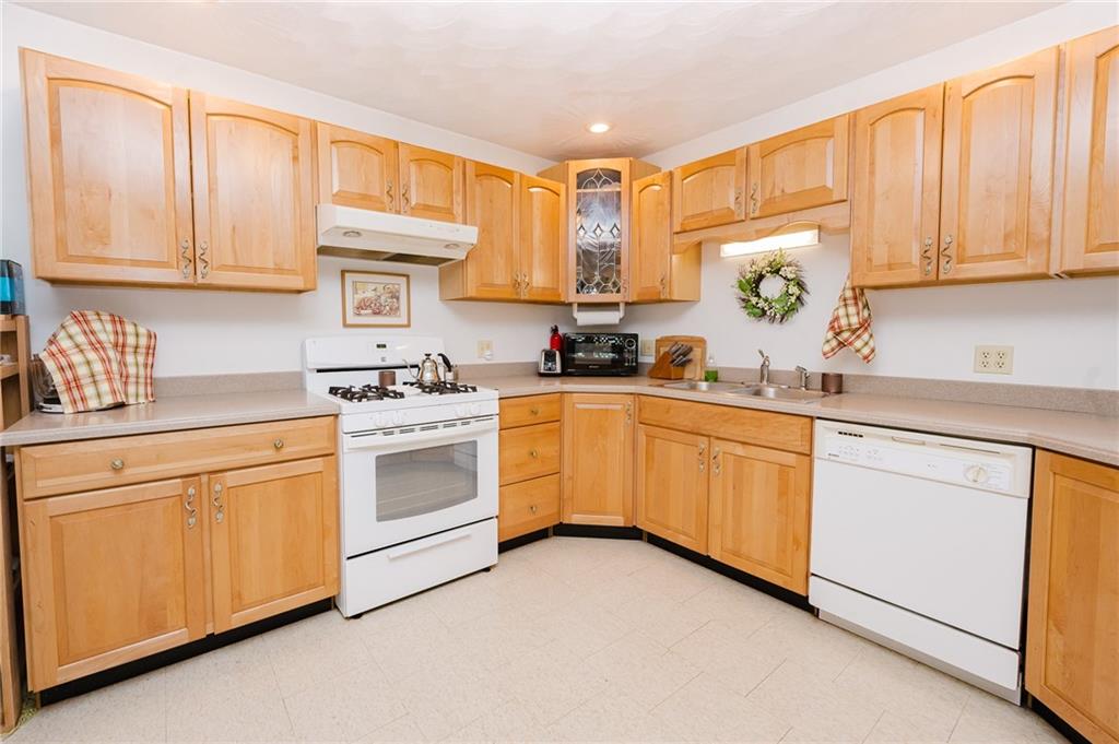 634 Ridge Avenue Ford City, PA 16226 - Photo 11 of 30 a kitchen with granite countertop white cabinets and white appliances