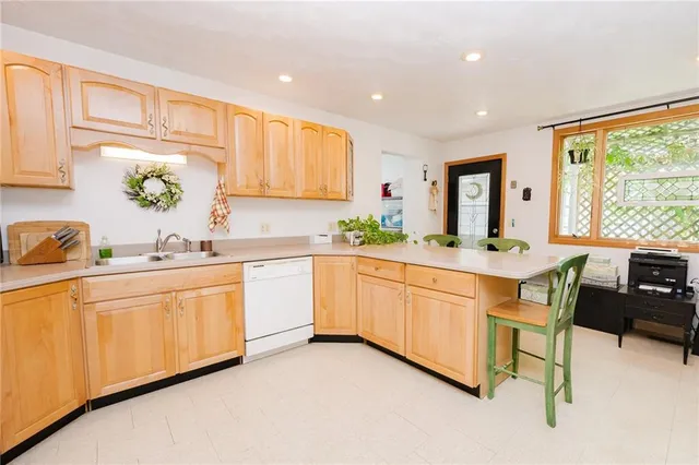 a kitchen with sink cabinets and window