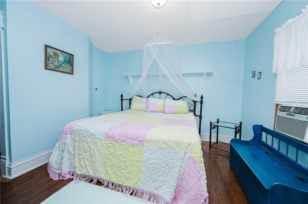 634 Ridge Avenue Ford City, PA 16226 - Photo 18 of 30 a bedroom with a bed and wooden floor