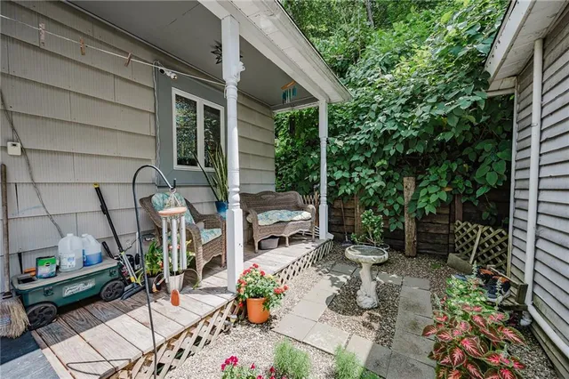 a backyard of a house with outdoor seating