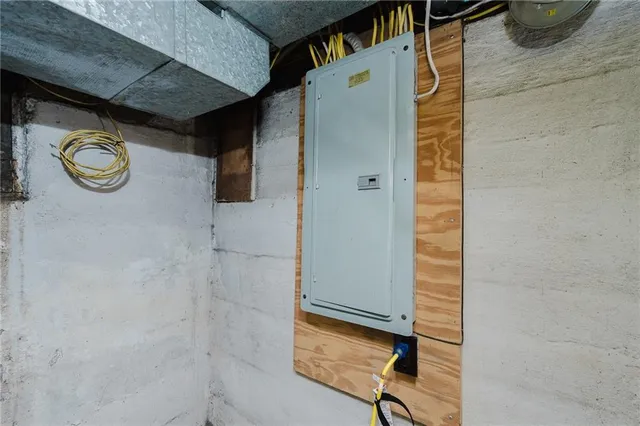 a utility room with dryer and washing machine