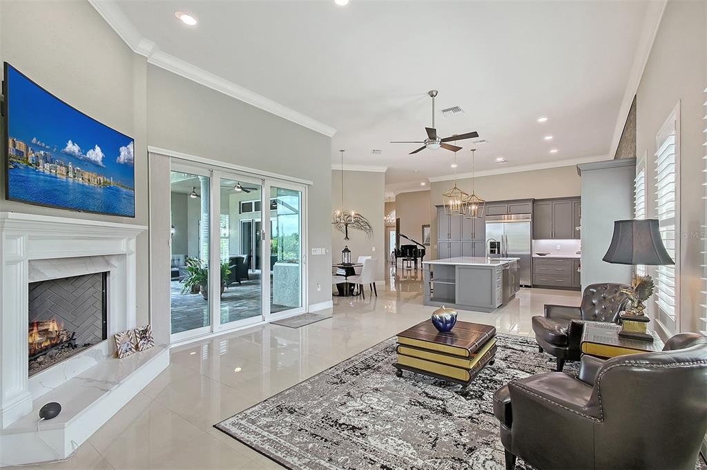 520 Rye Road Northeast Bradenton, FL 34212 - Photo 21 of 88 a living room with furniture and a fireplace