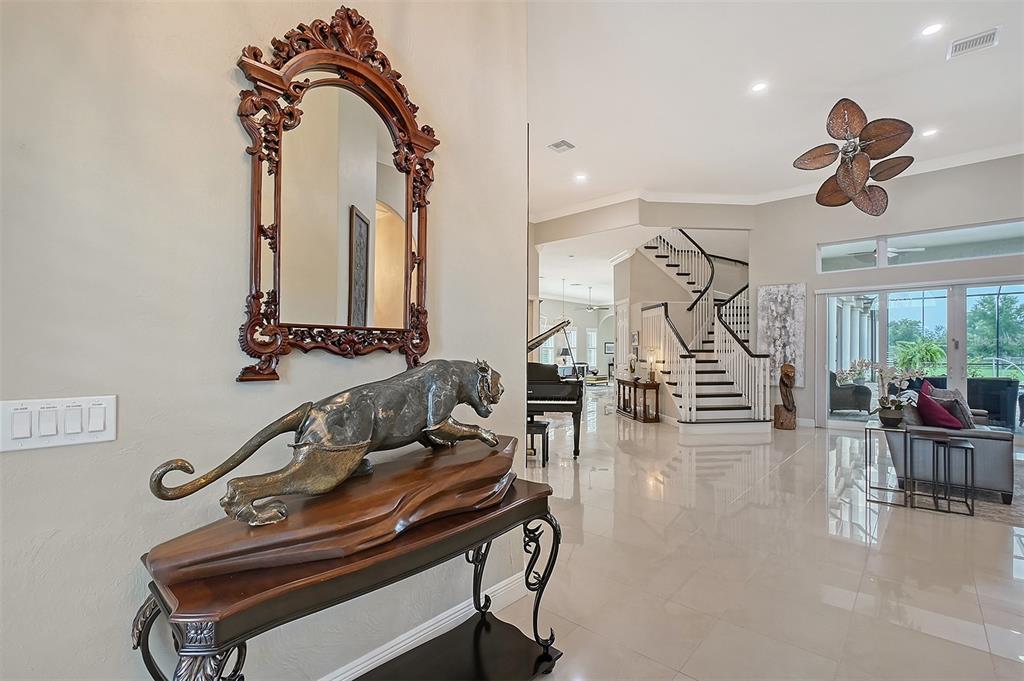 520 Rye Road Northeast Bradenton, FL 34212 - Photo 4 of 88 a view of a livingroom with furniture and a flat screen tv